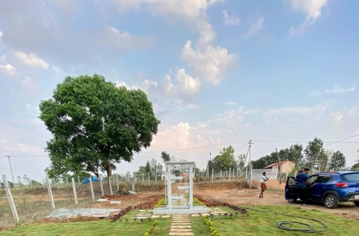 Customer farmhouse construction within managed farmland at Sangam Farms,