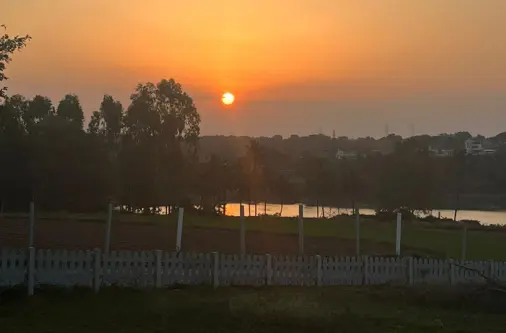Sunset view over Lakeview Farmland managed farm plots in denkanikottai