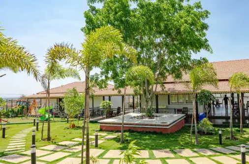 Green walkway and landscaped area inside farmland project